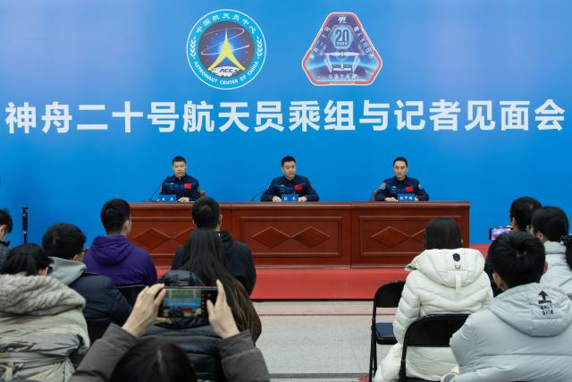 (260116) -- BEIJING, Jan. 16, 2026 (Xinhua) -- Astronaut Chen Dong (C) from China's Shenzhou-20 crewed mission speaks during a press conference in Beijing, capital of China, Jan. 16, 2026. The three astronauts from China's Shenzhou-20 crewed mission met the press in Beijing on Friday, their first public appearance after returning to Earth in November last year. (Xinhua/Li Minggang)