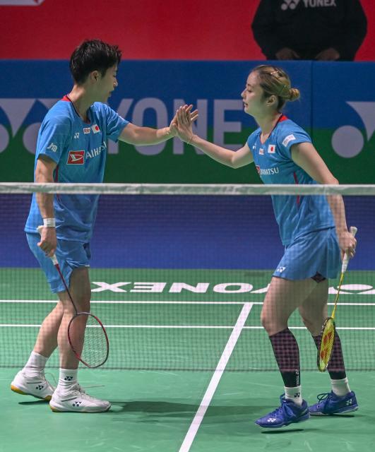 (260116) -- NEW DELHI, Jan. 16, 2026 (Xinhua) -- Japan's Shimogami Yuichi (L) /Hobara Sayaka celebrate after winning a point during the mixed doubles quarter final match against China's Jiang Zhenbang/Wei Yaxin at the India Open 2026 in New Delhi, India, Jan. 16, 2026. (Xinhua/Javed Dar)