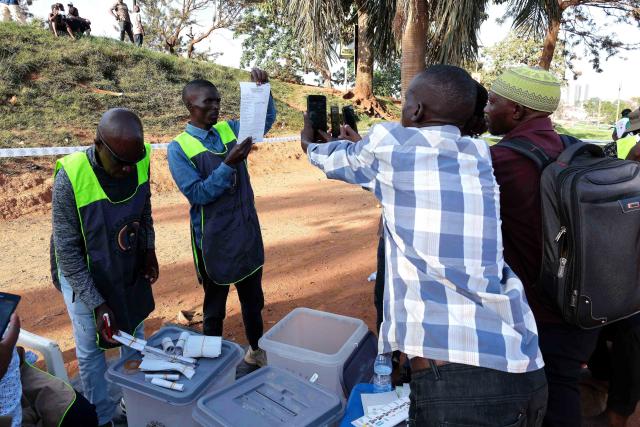(260116) -- KAMPALA, Jan. 16, 2026 (Xinhua) -- Polling officials count votes at a polling station in Kampala, Uganda on Jan. 15, 2026. Initial results show Uganda's incumbent President Yoweri Museveni took a lead in the presidential election, the country's electoral body said on Friday.
   Uganda on Thursday held presidential and parliamentary elections, with more than 21 million Ugandans expected to cast ballots to elect the president and 353 directly elected members of parliament.
   TO GO WITH "Preliminary results show Museveni leads Uganda's presidential election" (Photo by Hajarah Nalwadda/Xinhua)