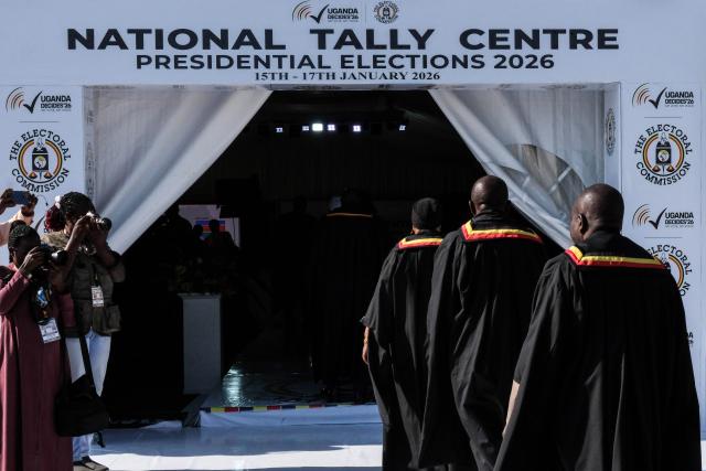 (260116) -- KAMPALA, Jan. 16, 2026 (Xinhua) -- Officials of Uganda's Electoral Commission arrive at the National Tally Center in Kampala, Uganda on Jan. 16, 2026. Initial results show Uganda's incumbent President Yoweri Museveni took a lead in the presidential election, the country's electoral body said on Friday.
   Uganda on Thursday held presidential and parliamentary elections, with more than 21 million Ugandans expected to cast ballots to elect the president and 353 directly elected members of parliament.
   TO GO WITH "Preliminary results show Museveni leads Uganda's presidential election" (Photo by Hajarah Nalwadda/Xinhua)