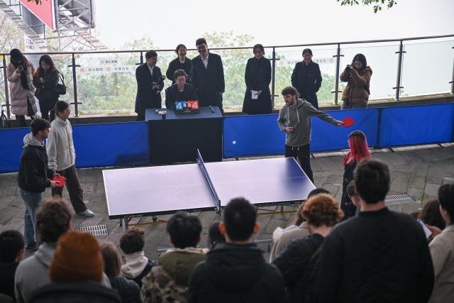 (260116) -- CHONGQING, Jan. 16, 2026 (Xinhua) -- Chinese and American youths participate in a friendly game of ping-pong at the Stilwell Museum in southwest China's Chongqing, on Jan. 16, 2026. Nineteen faculty and students from Elon University in the United States joined peers from Sichuan University, Sichuan International Studies University, and Chongqing Nankai Secondary School for an exchange event at the Stilwell Museum on Friday. The Museum is named after Joseph Stilwell, a U.S. general who helped the Chinese people in their fight against Japanese aggression during World War II.
   Co-hosted by the Chongqing People's Association for Friendship with Foreign Countries and the Stilwell Research Center, the event featured a tour of Joseph Stilwell's former residence and a WWII exhibition, culminating in a friendly game of ping-pong between the Chinese and American youths. (Xinhua/Chen Cheng)