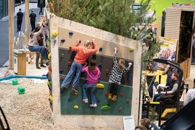 (260116) -- BERLIN, Jan. 16, 2026 (Xinhua) -- Children try rock climbing at the Berlin Green Week in Berlin, Germany, Jan. 16, 2026. This year's Berlin Green Week takes place from January 16 to 25, with more than 1,600 exhibitors presenting food, agriculture and horticulture products. The event marks its 100th anniversary this year. (Xinhua/Zhang Haofu)