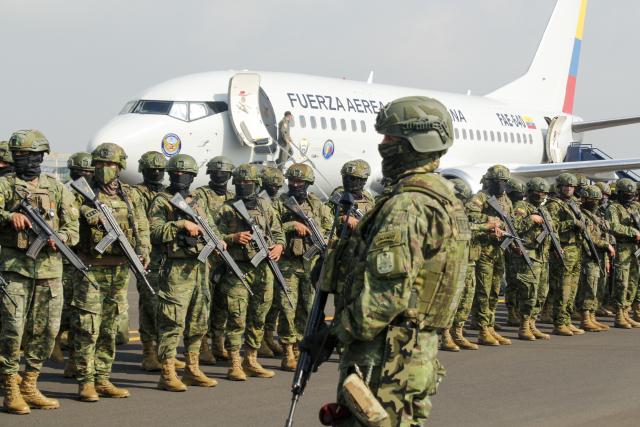 (260116) -- GUAYAQUIL, Jan. 16, 2026 (Xinhua) -- Members of the Ecuadorian Armed Forces remain in formation after their arrival at a military airbase in Guayaquil, Ecuador, Jan. 16, 2026. The Government of Ecuador announced on Thursday a massive deployment of nearly 10,000 military personnel in the coastal provinces, as part of a new offensive phase against organized crime. (Photo by Ricardo Landeta/Xinhua)