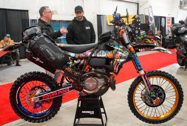 (260117) -- ABBOTSFORD, Jan. 17, 2026 (Xinhua) -- People look at a motorcycle during the 2026 BC Motorcycle and Powersports Show in Abbotsford, British Columbia, Canada, on Jan. 16, 2026. The three-day event kicked off here on Friday, featuring the latest motorcycles, cruisers, off-road bikes, All-Terrain Vehicles (ATV), and electric-powered vehicles. (Photo by Liang Sen/Xinhua)