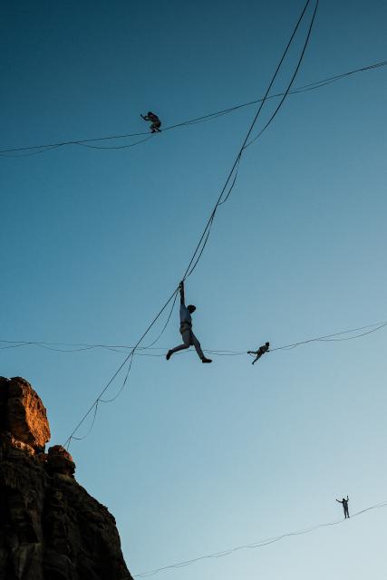 (260117) -- ALULA, Jan. 17, 2026 (Xinhua) -- Acrobats present an aerial art performance titled Vertigo in AlUla, Saudi Arabia, Jan. 16, 2026. Originally presented in Paris, Vertigo combines highlining, acrobatics and immersive music to explore gravity, self-transcendence and the power of solidarity through the performers' dynamic interaction with space. (Xinhua/Xin Mengchen)
