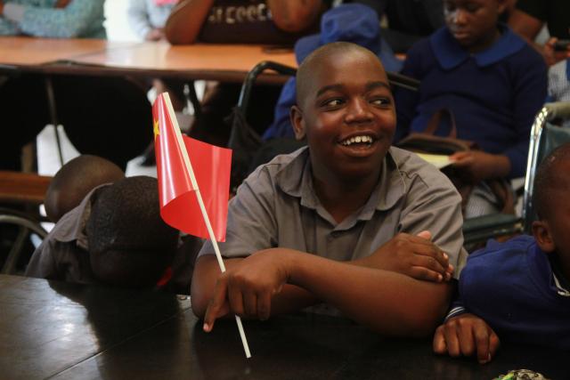 (260117) -- HARARE, Jan. 17, 2026 (Xinhua) -- A student attends a donation ceremony at the Jairos Jiri Centre Primary School in Harare, Zimbabwe, on Jan. 16, 2026. The Chinese Embassy in Zimbabwe on Friday donated daily necessities and stationery to a school for children with disabilities in Zimbabwe's capital.
   TO GO WITH "Chinese community donates supplies to children with disabilities in Zimbabwe" (Photo by Tafara Mugwara/Xinhua)