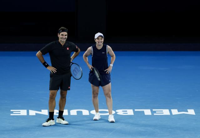 (260117) -- MELBOURNE, Jan. 17, 2026 (Xinhua) -- Former tennis players Roger Federer (L) of Switzerland and Ash Barty of Australia react during the opening ceremony exhibition match at the 2026 Australian Open at Melbourne Park in Melbourne, Australia, Jan. 17, 2026. (Xinhua/Ma Ping)