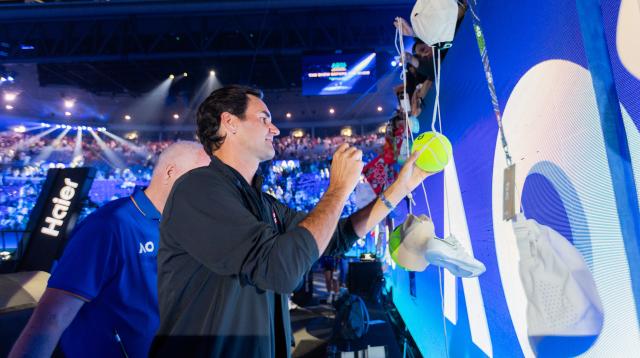 (260117) -- MELBOURNE, Jan. 17, 2026 (Xinhua) -- Former tennis player Roger Federer of Switzerland signs autograph after the opening ceremony exhibition match at the 2026 Australian Open at Melbourne Park in Melbourne, Australia, Jan. 17, 2026. (Photo by Hu Jingchen/Xinhua)