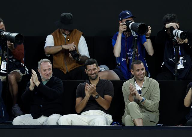 (260117) -- MELBOURNE, Jan. 17, 2026 (Xinhua) -- Novak Djokovic (below C) of Serbia is seen during the opening ceremony exhibition match at the 2026 Australian Open at Melbourne Park in Melbourne, Australia, Jan. 17, 2026. (Xinhua/Ma Ping)