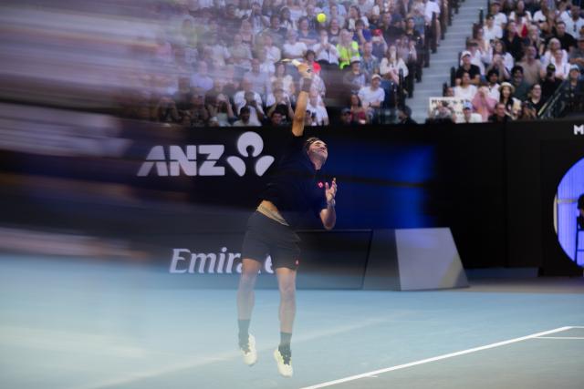(260117) -- MELBOURNE, Jan. 17, 2026 (Xinhua) -- Former tennis player Roger Federer of Switzerland serves during the opening ceremony exhibition match at the 2026 Australian Open at Melbourne Park in Melbourne, Australia, Jan. 17, 2026. (Photo by Hu Jingchen/Xinhua)