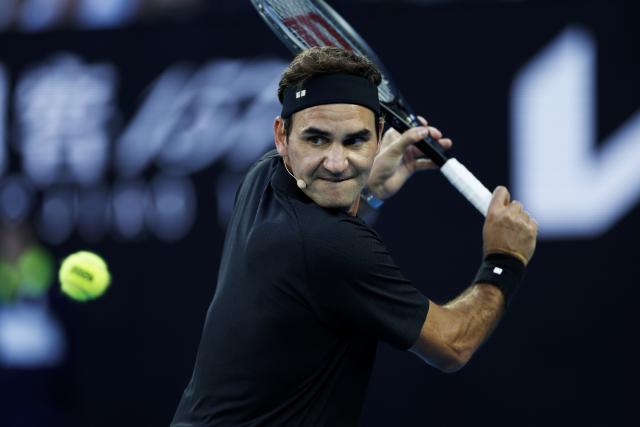 (260117) -- MELBOURNE, Jan. 17, 2026 (Xinhua) -- Former tennis player Roger Federer of Switzerland hits a return during the opening ceremony exhibition match at the 2026 Australian Open at Melbourne Park in Melbourne, Australia, Jan. 17, 2026. (Xinhua/Ma Ping)
