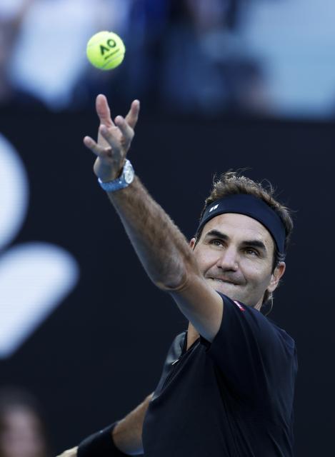(260117) -- MELBOURNE, Jan. 17, 2026 (Xinhua) -- Former tennis player Roger Federer of Switzerland serves during the opening ceremony exhibition match at the 2026 Australian Open at Melbourne Park in Melbourne, Australia, Jan. 17, 2026. (Xinhua/Ma Ping)