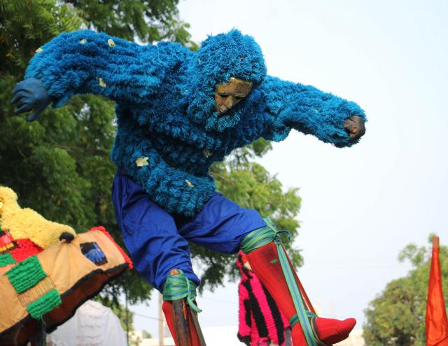 (260117) -- OUIDAH, Jan. 17, 2026 (Xinhua) -- A costumed stilt walker performs during the opening ceremony of the 17th Agogo International Dance Festival, in Ouidah, Benin, on Jan. 16, 2026. The festival, featuring dancers and acrobats from around the world, runs until Jan. 18. (Photo by Seraphin Zounyekpe/Xinhua)