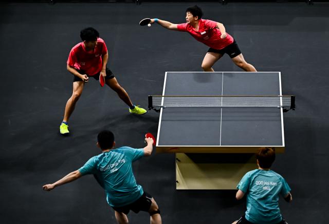 (260118) -- DOHA, Jan. 18, 2026 (Xinhua) -- Pang Koen (top L)/Zeng Jian (top R) of Singapore compete during the mixed doubles semifinal match against Wong Chun Ting/Doo Hoi Kem of China's Hong Kong at the WTT Star Contender Doha 2026 in Doha, Qatar, on Jan. 17, 2026. (Photo by Nikku/Xinhua)