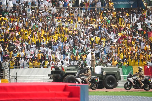 (260118) -- CONAKRY, Jan. 18, 2026 (Xinhua) -- Guinea's president-elect Mamady Doumbouya appears in a military vehicle and waves to spectators during the inauguration ceremony in Conakry, Guinea, Jan. 17, 2026. Mamady Doumbouya was officially sworn in as president of the Republic of Guinea for a seven-year term on Saturday, in accordance with the provisions of the country's new Constitution. (Xinhua/Zhang Jian)