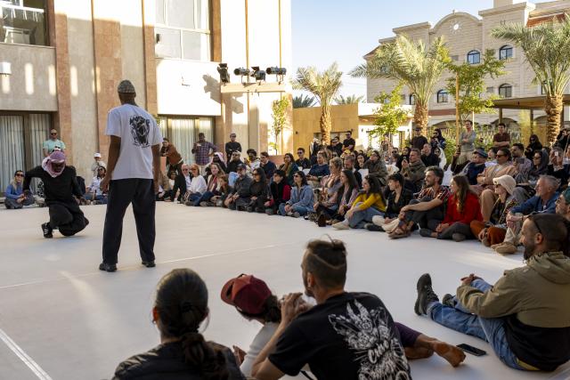 (260118) -- ALULA, Jan. 18, 2026 (Xinhua) -- People watch a dance performance in AlUla, Saudi Arabia, Jan. 17, 2026. Located in northwestern Saudi Arabia, AlUla is a world-class historical and cultural destination that combines breathtaking natural landscapes with a rich human heritage. 
   The region features lush oasis valleys, towering sandstone mountains, and ancient archaeological sites dating back thousands years ago. 
   Today, AlUla is also embracing contemporary trends and creativity, with year-round art festivals, exhibitions, and diverse cultural events, injecting modern vitality into this millennia-old city. (Xinhua/Xin Mengchen)