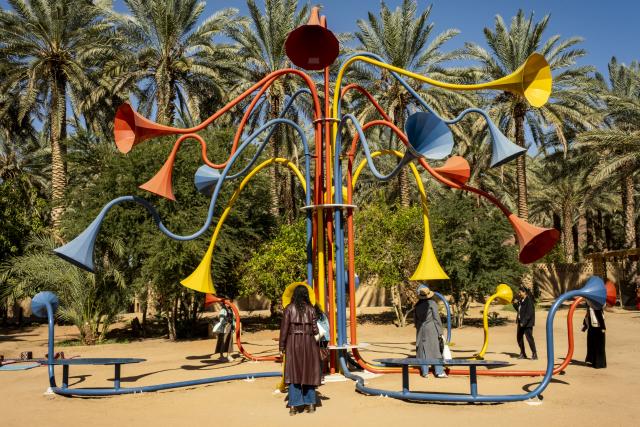 (260118) -- ALULA, Jan. 18, 2026 (Xinhua) -- People view an art installation in AlUla, Saudi Arabia, Jan. 16, 2026. Located in northwestern Saudi Arabia, AlUla is a world-class historical and cultural destination that combines breathtaking natural landscapes with a rich human heritage. 
   The region features lush oasis valleys, towering sandstone mountains, and ancient archaeological sites dating back thousands years ago. 
   Today, AlUla is also embracing contemporary trends and creativity, with year-round art festivals, exhibitions, and diverse cultural events, injecting modern vitality into this millennia-old city. (Xinhua/Xin Mengchen)