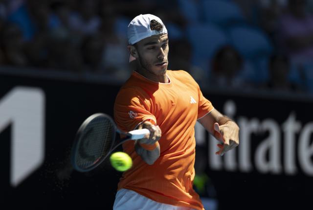 (260118) -- MELBOURNE, Jan. 18, 2026 (Xinhua) -- Francisco Cerundolo of Argentina hits a return during the men's singles first round match between Zhang Zhizhen of China and Francisco Cerundolo of Argentina at the Australian Open tennis tournament 2026 in Melbourne, Australia, Jan. 18, 2026. (Photo by Hu Jingchen/Xinhua)