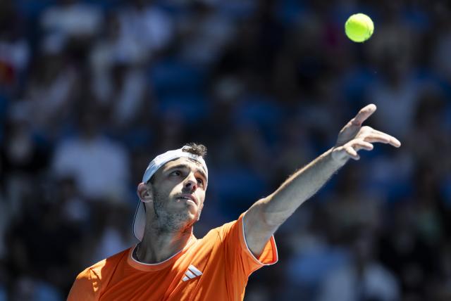 (260118) -- MELBOURNE, Jan. 18, 2026 (Xinhua) -- Francisco Cerundolo of Argentina serves during the men's singles first round match between Zhang Zhizhen of China and Francisco Cerundolo of Argentina at the Australian Open tennis tournament 2026 in Melbourne, Australia, Jan. 18, 2026. (Photo by Hu Jingchen/Xinhua)
