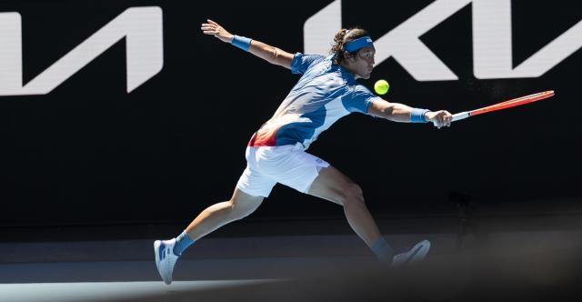 (260118) -- MELBOURNE, Jan. 18, 2026 (Xinhua) -- Zhang Zhizhen of China hits a return during the men's singles first round match between Zhang Zhizhen of China and Francisco Cerundolo of Argentina at the Australian Open tennis tournament 2026 in Melbourne, Australia, Jan. 18, 2026. (Photo by Hu Jingchen/Xinhua)