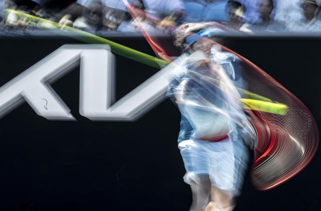 (260118) -- MELBOURNE, Jan. 18, 2026 (Xinhua) -- Zhang Zhizhen of China hits a return during the men's singles first round match between Zhang Zhizhen of China and Francisco Cerundolo of Argentina at the Australian Open tennis tournament 2026 in Melbourne, Australia, Jan. 18, 2026. (Photo by Hu Jingchen/Xinhua)