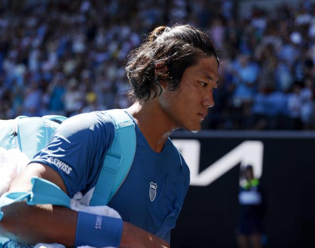 (260118) -- MELBOURNE, Jan. 18, 2026 (Xinhua) -- Zhang Zhizhen of China leaves the court after losing the men's singles first round match between Zhang Zhizhen of China and Francisco Cerundolo of Argentina at the Australian Open tennis tournament 2026 in Melbourne, Australia, Jan. 18, 2026. (Xinhua/Ma Ping)