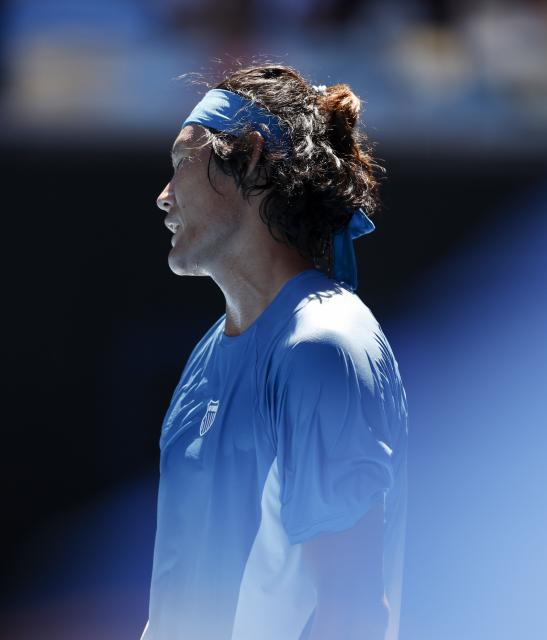 (260118) -- MELBOURNE, Jan. 18, 2026 (Xinhua) -- Zhang Zhizhen of China reacts during the men's singles first round match between Zhang Zhizhen of China and Francisco Cerundolo of Argentina at the Australian Open tennis tournament 2026 in Melbourne, Australia, Jan. 18, 2026. (Xinhua/Ma Ping)