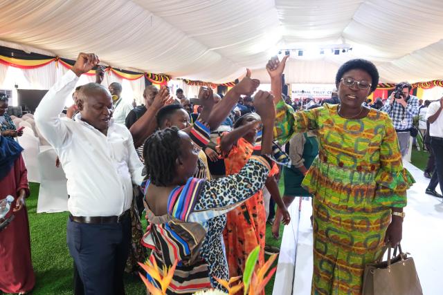 (260118) -- KAMPALA, Jan. 18, 2026 (Xinhua) -- People celebrate after Yoweri Museveni won in the presidential election 2026 at National Tally Center in Kampala, Uganda, on Jan. 17, 2026. Uganda's incumbent President Yoweri Museveni won the country's presidential election, the Electoral Commission (EC) said on Saturday as it released the final results at the National Tally Center in the capital, Kampala. (Photo by Hajarah Nalwadda/Xinhua)