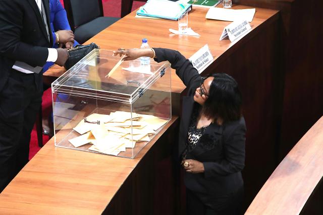 (260118) -- ABIDJAN, Jan. 18, 2026 (Xinhua) -- A member of the National Assembly casts a ballot in a ballot box in Abidjan, Cote d'Ivoire, on Jan. 17, 2026. Former Cote d'Ivoire Prime Minister Patrick Achi was elected on Saturday as the new president of the National Assembly in Abidjan, official sources disclosed. (Photo by Yvan Sonh/Xinhua)