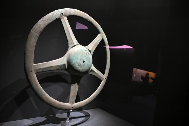 (260118) -- BEIJING, Jan. 18, 2026 (Xinhua) -- This photo taken on Jan. 18, 2026 shows a sun-shaped bronzeware on display during an exhibition named "Ancient Shu Civilization of the Sanxingdui and Jinsha Sites" at the National Museum of China in Beijing, capital of China. With more than 200 pieces (sets) of relics featuring ancient Shu civilization, the exhibition kicked off here on Sunday and will last until Aug. 18. (Xinhua/Jin Liangkuai)