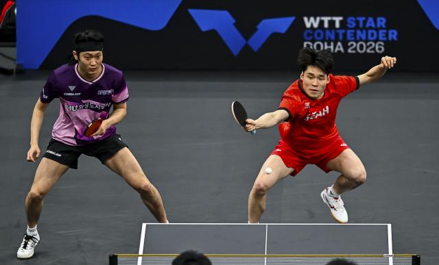 (260118) -- DOHA, Jan. 18, 2026 (Xinhua) -- Jang Woojin (R)/Cho Daeseong of South Korea compete during the men's doubles final match against Huang Youzheng/Wen Ruibo of China at WTT Star Contender Doha 2026 in Doha, Qatar, Jan. 17, 2026. (Photo by Nikku/Xinhua)