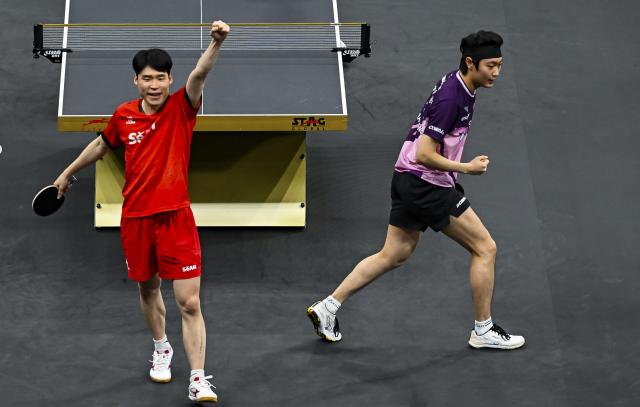 (260118) -- DOHA, Jan. 18, 2026 (Xinhua) -- Jang Woojin (L)/Cho Daeseong of South Korea react during the men's doubles final match against Huang Youzheng/Wen Ruibo of China at WTT Star Contender Doha 2026 in Doha, Qatar, Jan. 17, 2026. (Photo by Nikku/Xinhua)