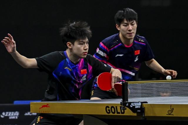 (260118) -- DOHA, Jan. 18, 2026 (Xinhua) -- Huang Youzheng (L)/Wen Ruibo of China compete during the men's doubles final match against Jang Woojin/Cho Daeseong of South Korea at WTT Star Contender Doha 2026 in Doha, Qatar, Jan. 17, 2026. (Photo by Nikku/Xinhua)