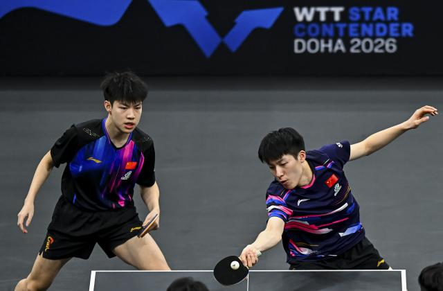 (260118) -- DOHA, Jan. 18, 2026 (Xinhua) -- Huang Youzheng/Wen Ruibo (R) of China compete during the men's doubles final match against Jang Woojin/Cho Daeseong of South Korea at WTT Star Contender Doha 2026 in Doha, Qatar, Jan. 17, 2026. (Photo by Nikku/Xinhua)