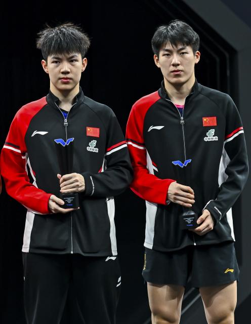 (260118) -- DOHA, Jan. 18, 2026 (Xinhua) -- Silver medalists Huang Youzheng (L)/Wen Ruibo of China pose for photos during the awarding ceremony after the men's doubles final match against Jang Woojin/Cho Daeseong of South Korea at WTT Star Contender Doha 2026 in Doha, Qatar, Jan. 17, 2026. (Photo by Nikku/Xinhua)