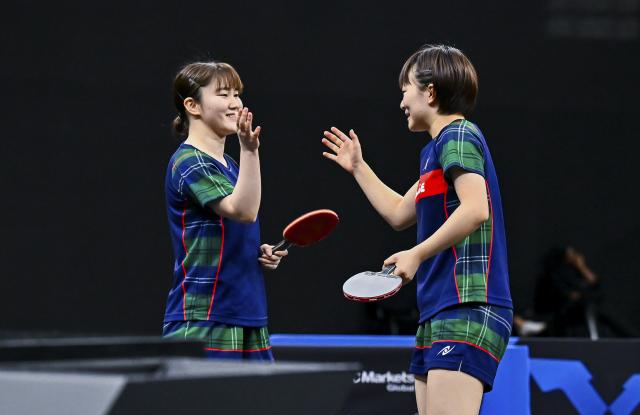 (260118) -- DOHA, Jan. 18, 2026 (Xinhua) -- Yokoi Sakura/Odo Satsuki (L) of Japan celebrate after winning the women's doubles final match against Sato Hitomi/Shibata Saki of Japan at the WTT Star Contender Doha 2026 in Doha, Qatar, Jan. 17, 2026. (Photo by Nikku/Xinhua)