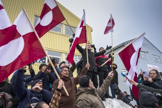 (260118) -- BEIJING, Jan. 18, 2026 (Xinhua) -- Greenland's Prime Minister Jens-Frederik Nielsen (L, on the snow) is seen during a demonstration against U.S. actions and remarks suggesting control over Greenland in Nuuk, capital of Greenland, an autonomous territory of Denmark, Jan. 17, 2026. (Photo by Anders Kongshaug/Xinhua)
