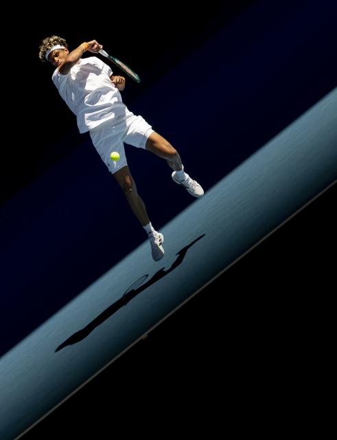 (260118) -- MELBOURNE, Jan. 18, 2026 (Xinhua) -- Gabriel Diallo hits a return during the men's singles 1st round match between Alexander Zverev of Germany and Gabriel Diallo of Canada at the Australian Open tennis tournament in Melbourne, Australia, Jan. 18, 2026. (Photo by Hu Jingchen/Xinhua)