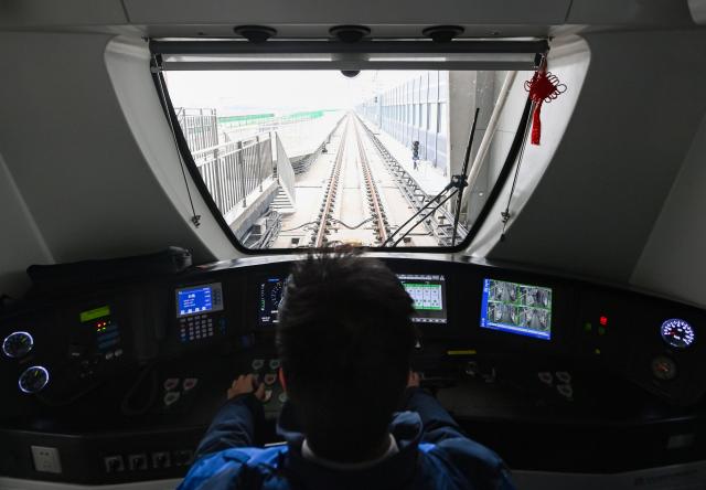 (260118) -- TIANJIN, Jan. 18, 2026 (Xinhua) -- A driver of Tianjin Rail Transit Line Z4 prepares before operation in north China's Tianjin, Jan. 18, 2026. The northern section of the first phase of Tianjin Rail Transit Line Z4 began operations on Sunday.
   The newly opened section spans 23.7 kilometers with 10 stations. Upon completion, the full Phase 1 line will cover a total length of 43.7 kilometers with 24 stations.
   As a backbone line linking the northern and southern parts of the Binhai New Area with its core district, the Z4 line is expected to play a vital role in optimizing the regional rail system and promoting integration. (Xinhua/Zhao Zishuo)