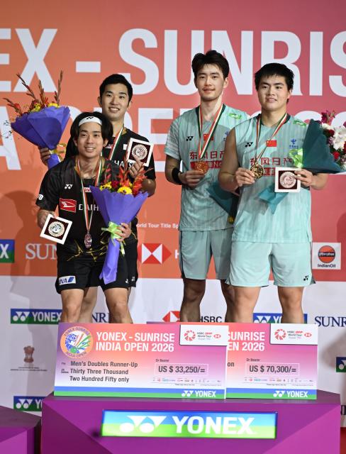 (260118) -- NEW DELHI, Jan. 18, 2026 (Xinhua) -- Winner Liang Weikeng (1st R)/Wang Chang (2nd R) of China and runner-up Midorikawa Hiroki (1st L)/Yamashita Kyohei of Japan pose for photos during the awarding ceremony for the men's doubles final match between Liang Weikeng/Wang Chang of China and Midorikawa Hiroki/Yamashita Kyohei of Japan at the India Open 2026 in New Delhi, India, Jan. 18, 2026. (Xinhua/Javed Dar)