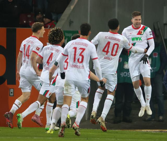 (260119) -- AUGSBURG, Jan. 19, 2026 (Xinhua) -- Elvis Rexhbecaj (1st R) of FC Augsburg celebrates scoring with his teammates during the German first division Bundesliga football match between FC Augsburg and SC Freiburg in Augsburg, Germany, Jan. 18, 2026. (Photo by Philippe Ruiz/Xinhua)