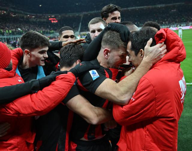 (260119) -- MILAN, Jan. 19, 2026 (Xinhua) -- AC Milan's Niclas Fullkrug (2nd R) celebrates his goal with his teammate during a Serie A football match between AC Milan and Lecce in Milan, Italy, Jan. 18, 2026. (Photo by Alberto Lingria/Xinhua)