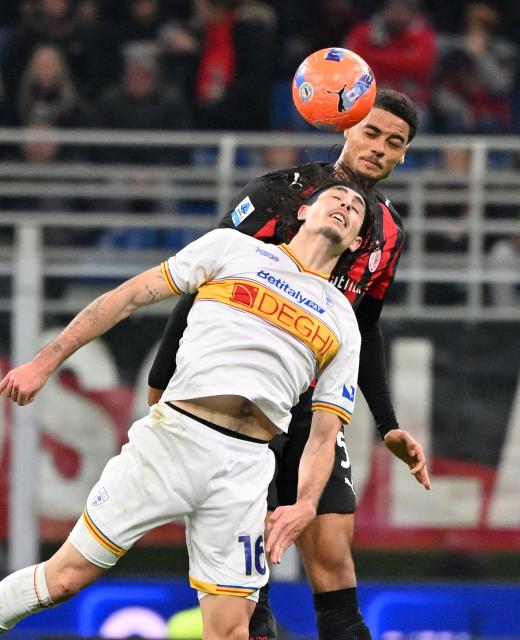 (260119) -- MILAN, Jan. 19, 2026 (Xinhua) -- AC Milan's  Koni De Winter (back) vies with Lecce's Omri Gandelman during a Serie A football match between AC Milan and Lecce in Milan, Italy, Jan. 18, 2026. (Photo by Alberto Lingria/Xinhua)