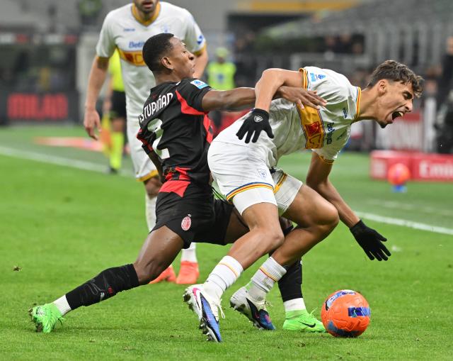 (260119) -- MILAN, Jan. 19, 2026 (Xinhua) -- AC Milan's Pervis Estupinian (L) vies with Lecce's Tiago Gabriel during a Serie A football match between AC Milan and Lecce in Milan, Italy, Jan. 18, 2026. (Photo by Alberto Lingria/Xinhua)