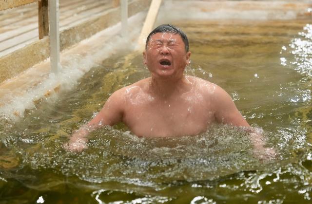 (260119) -- ASTANA, Jan. 19, 2026 (Xinhua) -- A man bathes in the icy water during the Orthodox Epiphany celebrations in Astana, Kazakhstan, Jan. 18, 2026. (Photo by Kalizhan Ospanov/Xinhua)