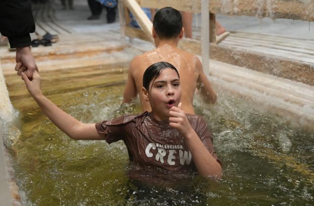 (260119) -- ASTANA, Jan. 19, 2026 (Xinhua) -- People bathe in the icy water during the Orthodox Epiphany celebrations in Astana, Kazakhstan, Jan. 18, 2026. (Photo by Kalizhan Ospanov/Xinhua)