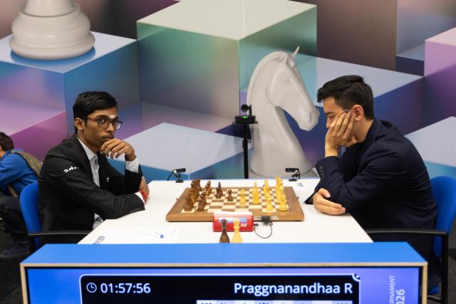 (260119) -- WIJK AAN ZEE, Jan. 19, 2026 (Xinhua) -- Praggnanandhaa Rameshbabu (L) of India competes against Nodirbek Abdusattorov of Uzbekistan during the second round of Tata Steel Chess Tournament 2026 in Wijk aan Zee, the Netherlands, on Jan. 18, 2026. (Photo by Sylvia Lederer/Xinhua)
