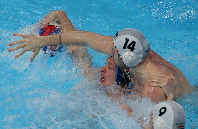 (260119) -- BELGRADE, Jan. 19, 2026 (Xinhua) -- Serbia's Djordje Lazic (L) vies with Hungary's Zsombor Vismeg during the group stage II group E match between Hungary and Serbia at the Men's European Water Polo Championships in Belgrade, Serbia, Jan. 18, 2026. (Photo by Predrag Milosavljevic/Xinhua)