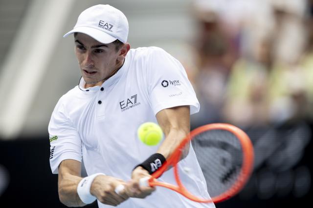 (260119) -- MELBOURNE, Jan. 19, 2026 (Xinhua) -- Matteo Arnaldi of Italy hits a return during the men's singles 1st round match against Andrey Rublev of Russia at the Australian Open tennis tournament in Melbourne, Australia, Jan. 19, 2026. (Photo by Hu Jingchen/Xinhua)