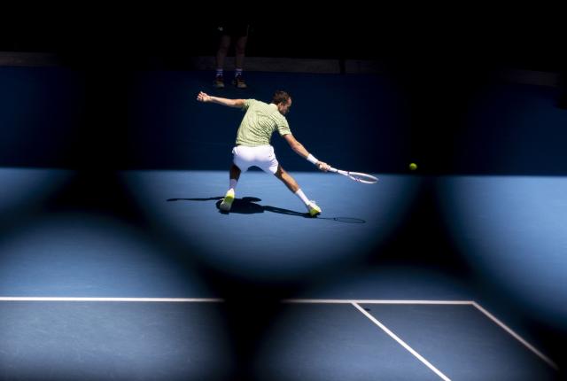 (260119) -- MELBOURNE, Jan. 19, 2026 (Xinhua) -- Daniil Medvedev of Russia hits a return during the men's singles 1st round match against Jesper de Jong of the Netherlands at the Australian Open tennis tournament in Melbourne, Australia, Jan. 19, 2026. (Photo by Hu Jingchen/Xinhua)